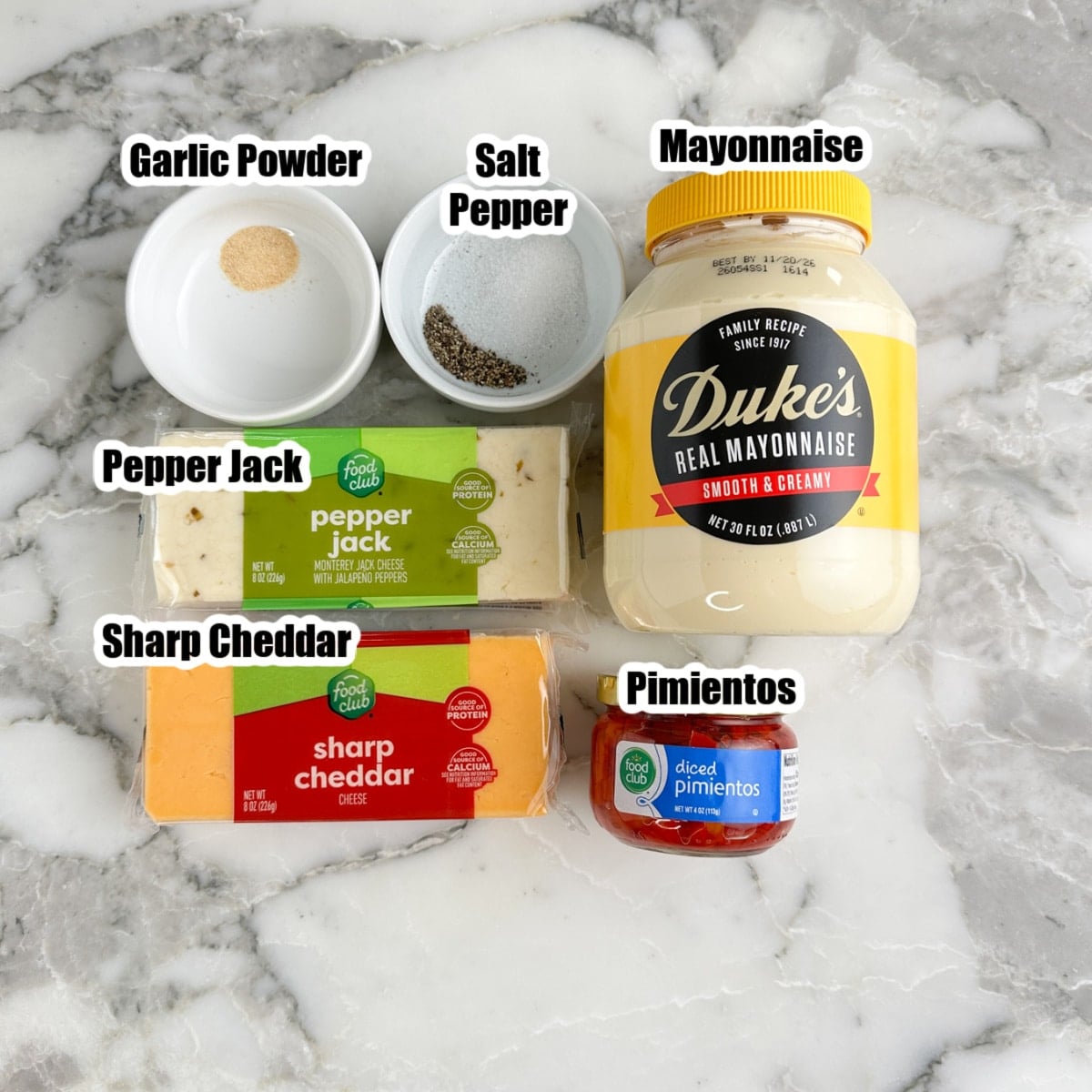 Pepper jack cheese, cheddar cheese, mayonnaise, pimientos, garlic powder, salt, and pepper. 