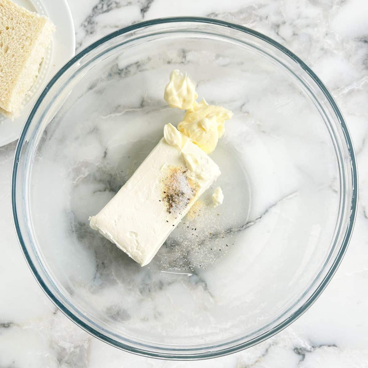 Bowl of cream cheese, mayonnaise, and seasonings.