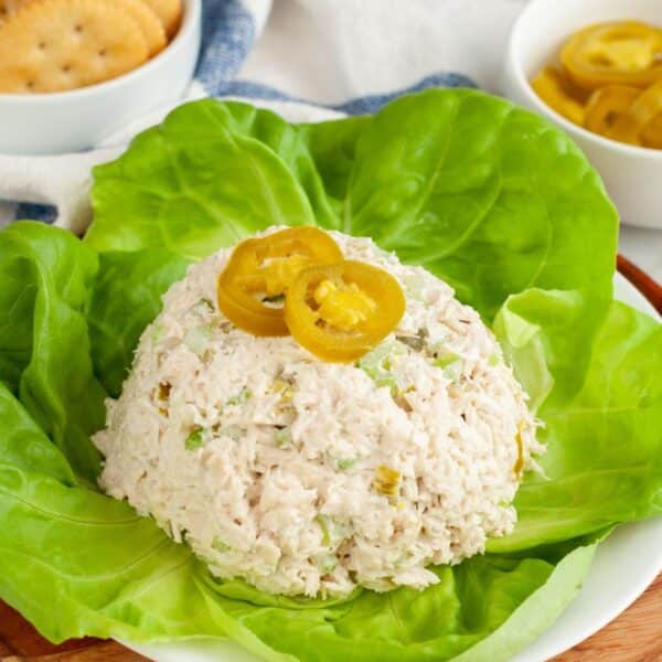 A scoop of jalapeno chicken salad topped with jalapeno slices.