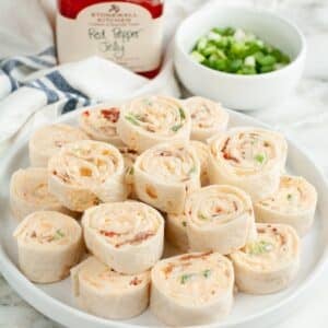 Plate of pepper jelly pinwheels.