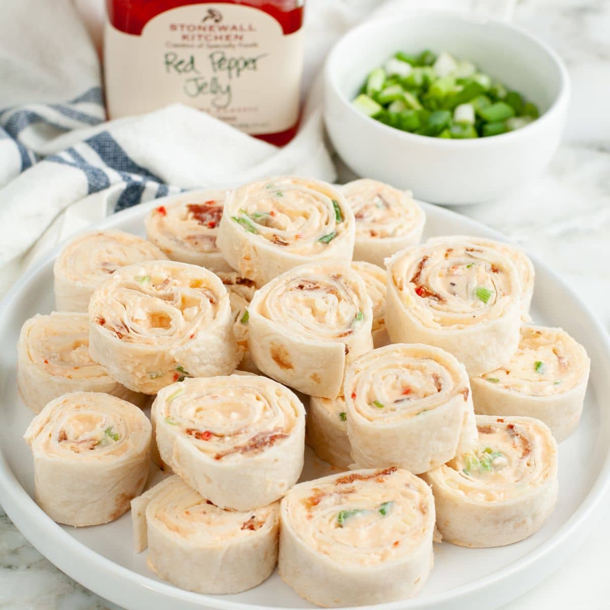Plate of pepper jelly pinwheels. 