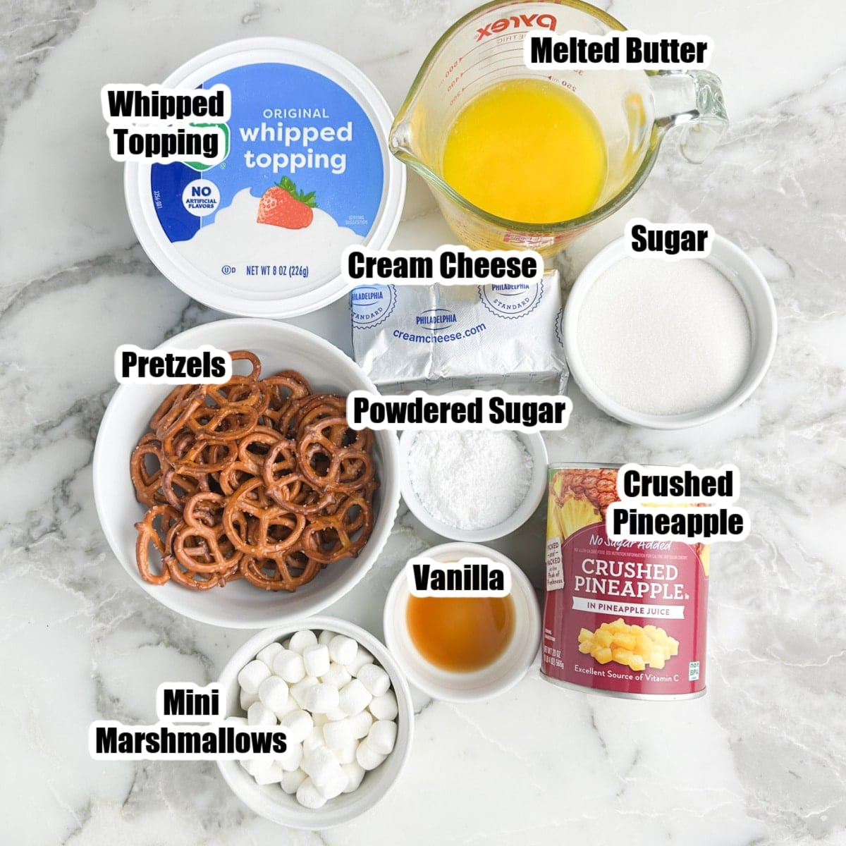 Bowl of pretzels, whipped topping, melted butter, sugar, cream cheese, pineapple, and mini marshmallows. 