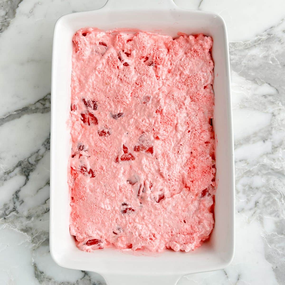 Baking dish with strawberry angel food cake dessert. 