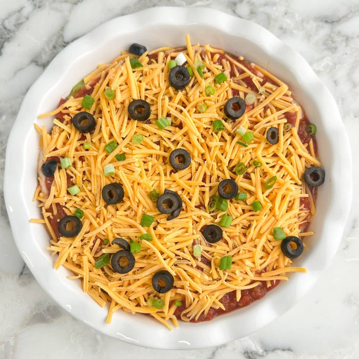 5 layer dip in a pie dish.