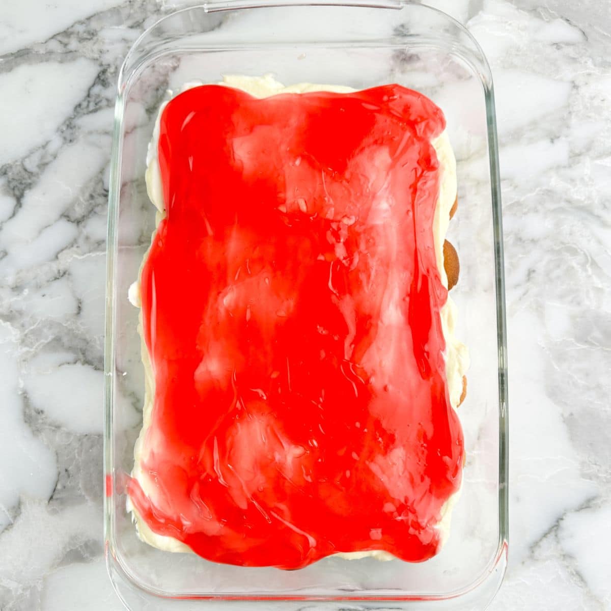 Baking dish with strawberry delight in a baking dish. 