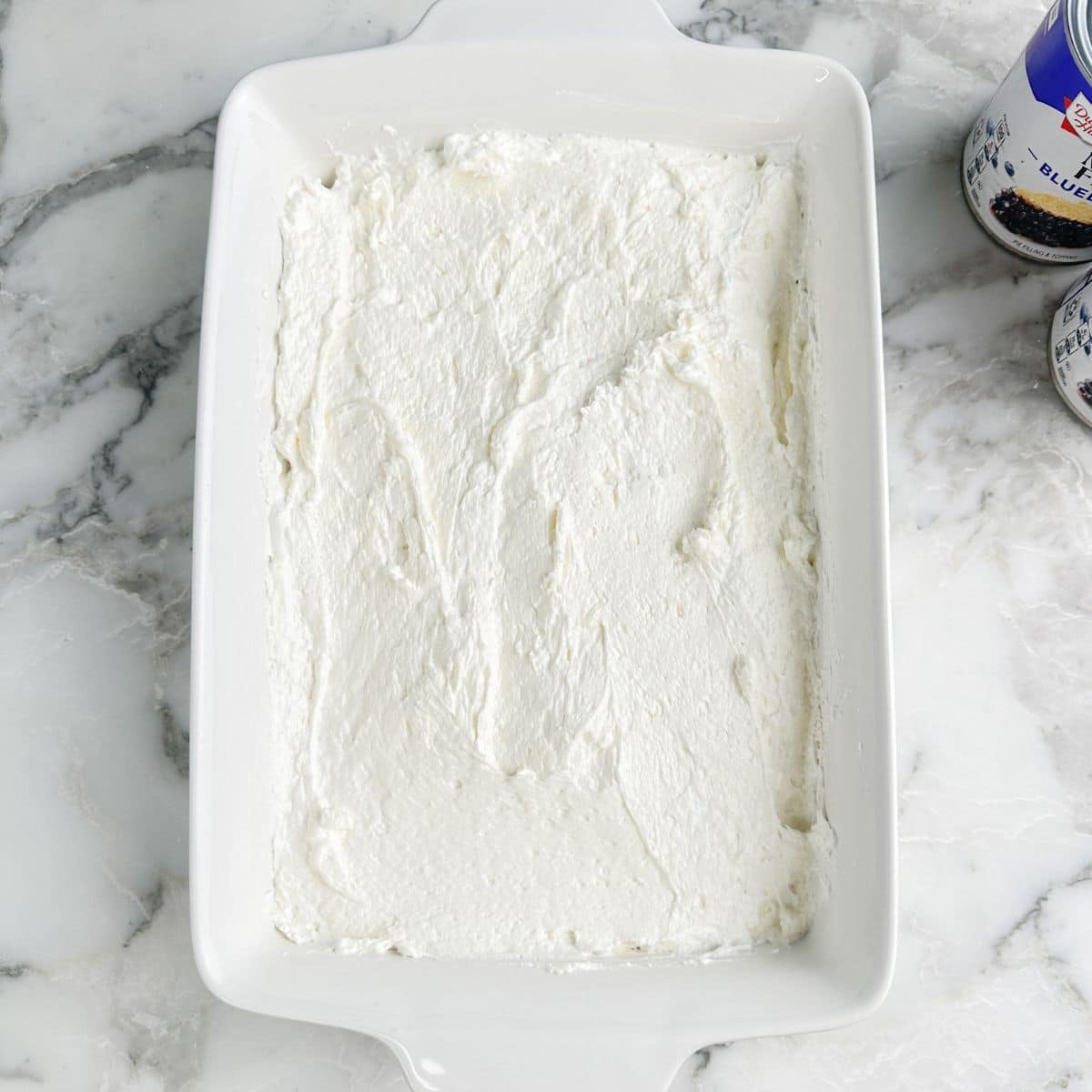 Baking dish with layer of cream cheese mixture. 