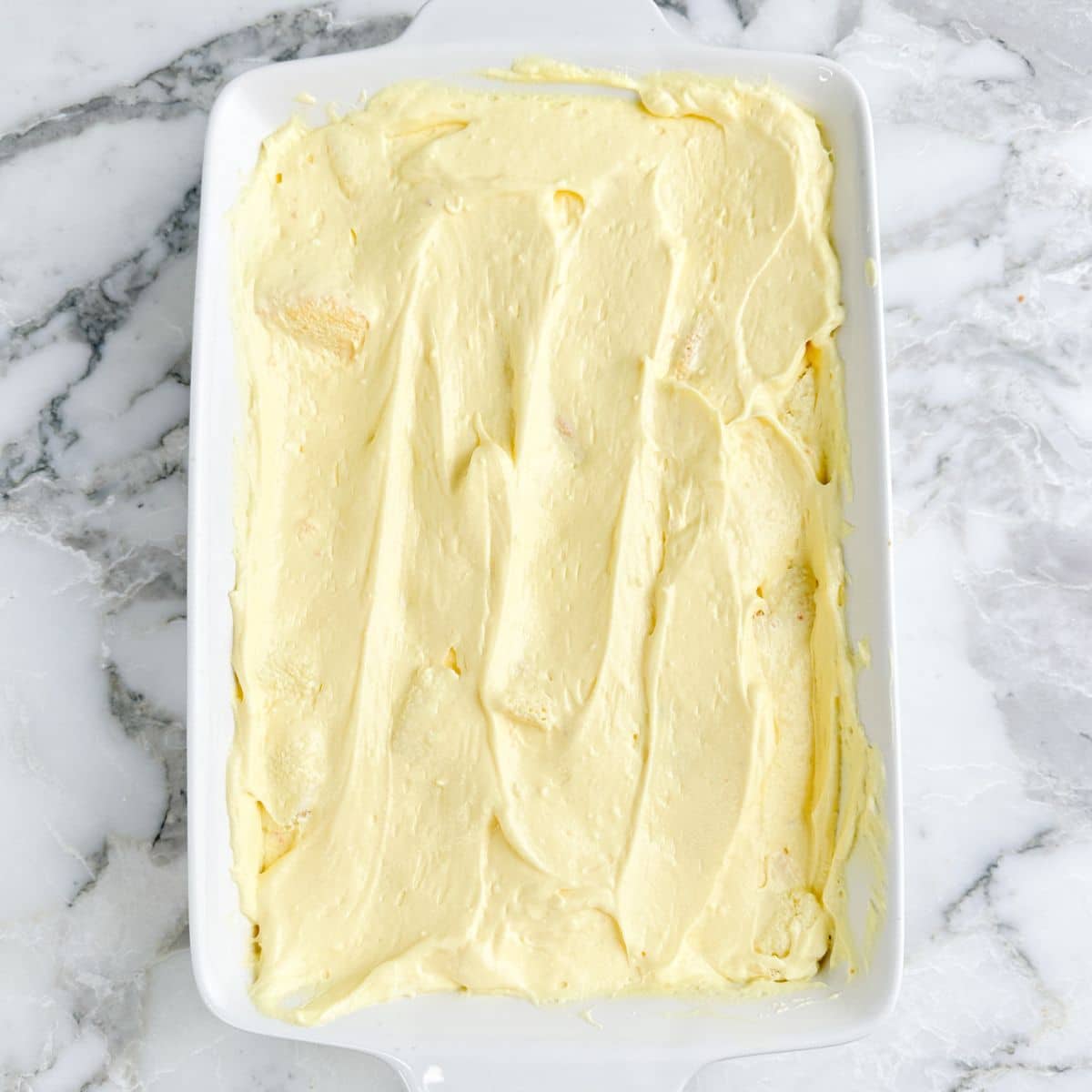 Baking dish with butterfinger dessert.