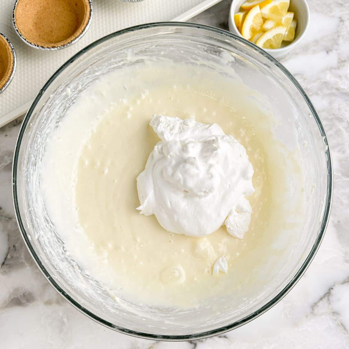 Bowl with cream cheese and whipped topping.