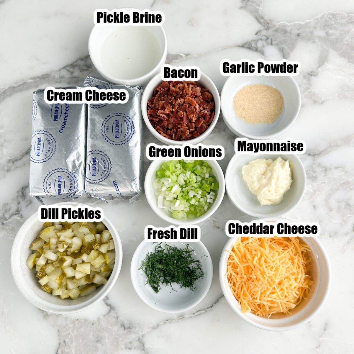 Cream cheese, bacon bits, dill pickles, green onions, cheese, mayonnaise, dill, and mayonnaise.