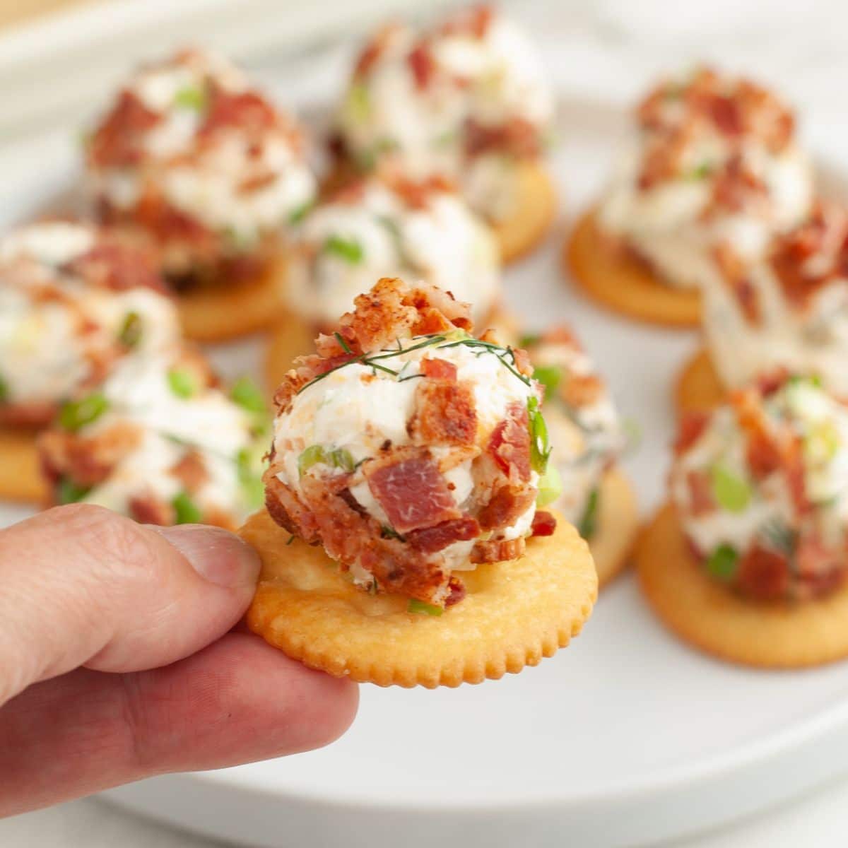 Ritz crackers topped with cheese balls.