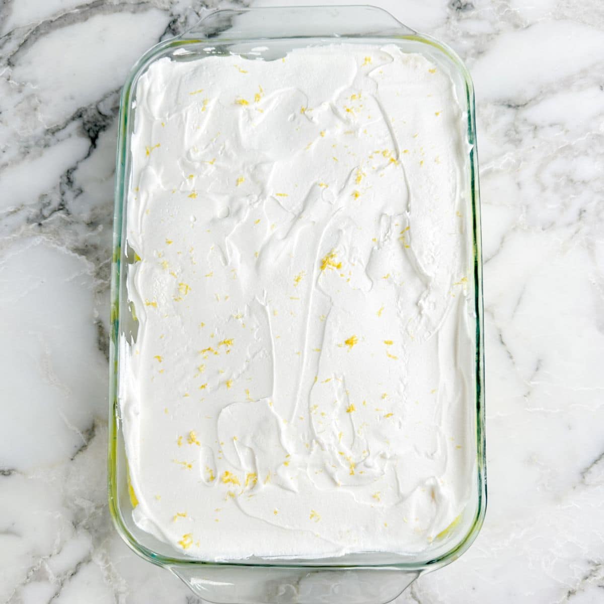 Baking dish with no bake lemon lush dessert.