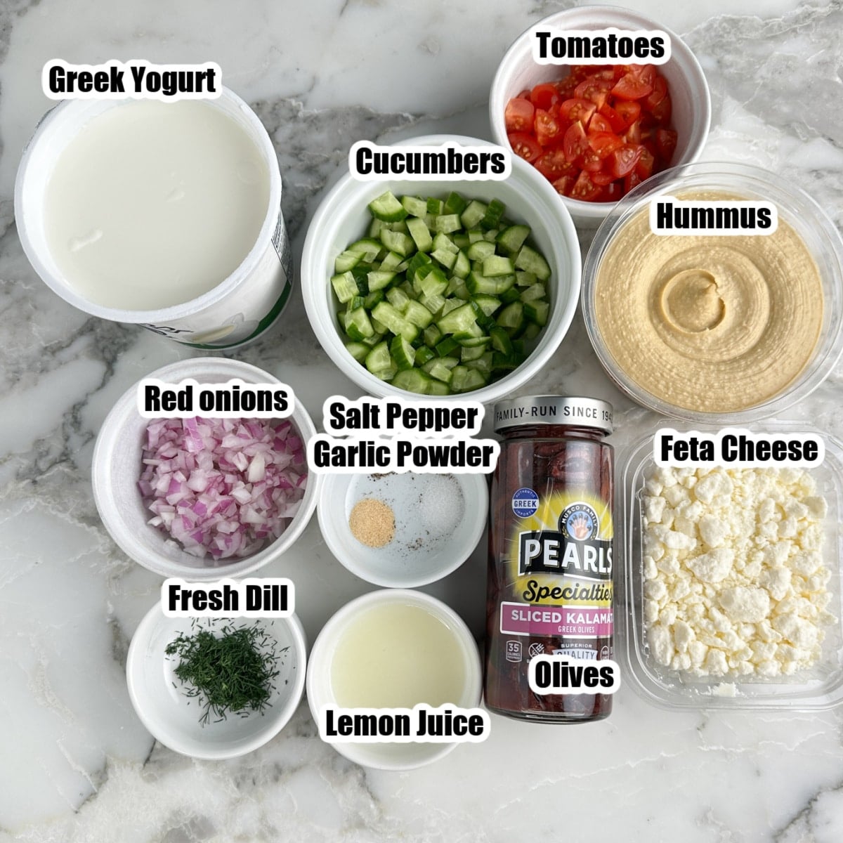Greek yogurt, diced cucumbers, red onion, tomatoes, dill, lemon juice, olives, Feta cheese, hummus, and seasonings.