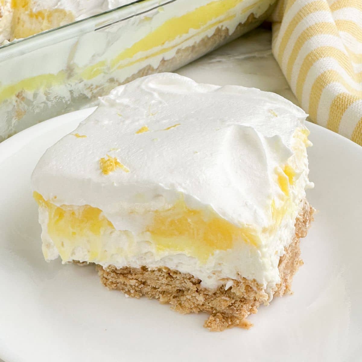Piece of lemon lush on a plate.