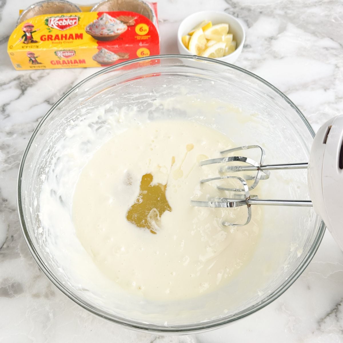 Bowl with whipped cream cheese and lemonade.