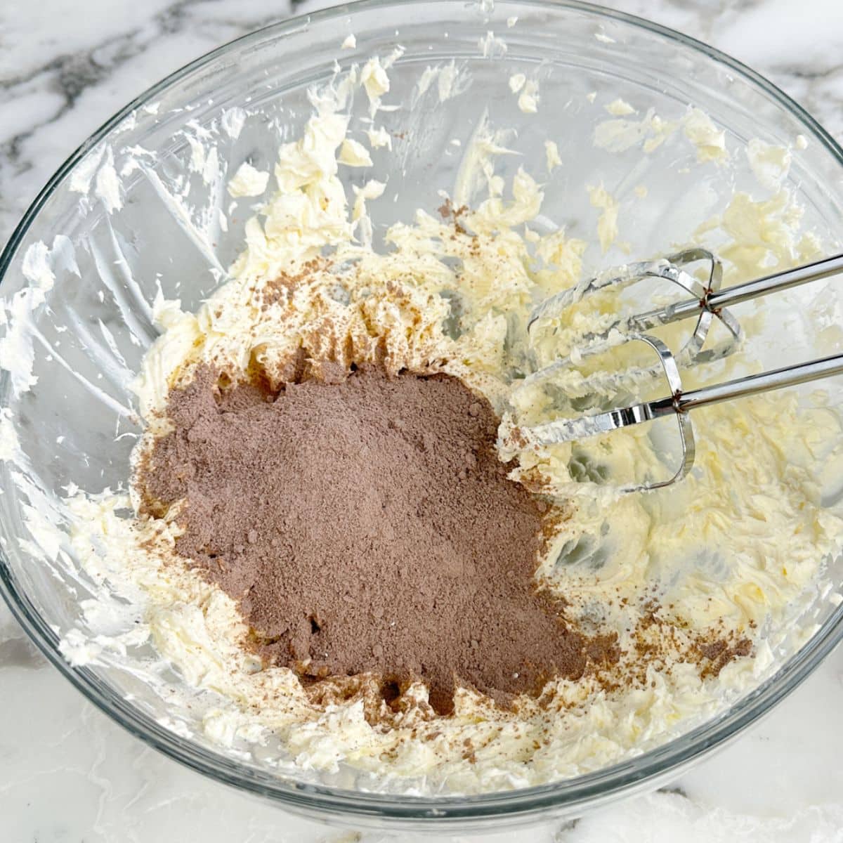 Bowl with creamed cheese and chocolate pudding mix. 