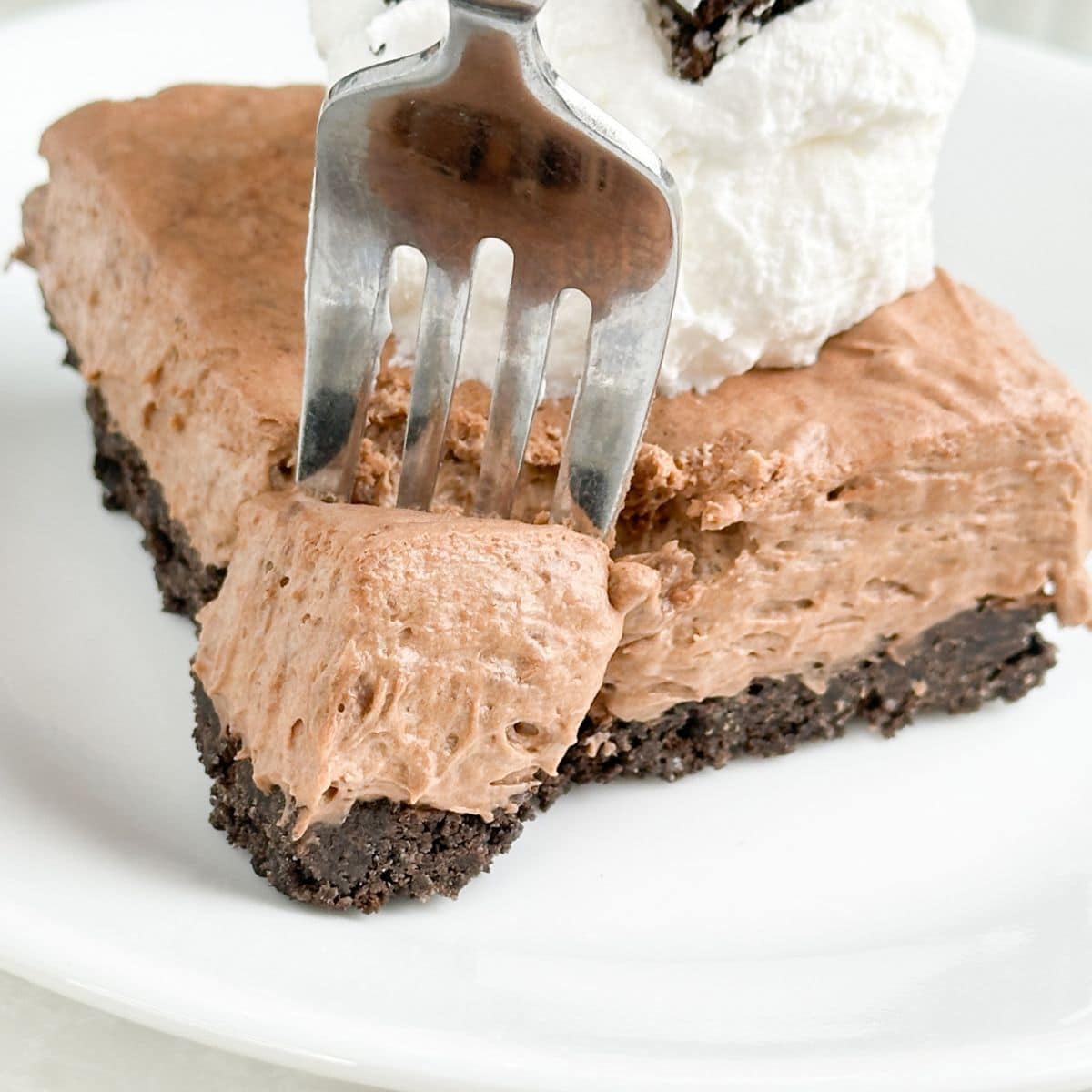 Plate with chocolate Cool Whip pie and a fork. 