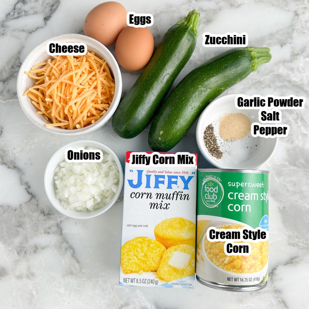 Zucchini, shredded cheese, eggs, Jiffy mix, creamed corn, onions, and seasonings. 
