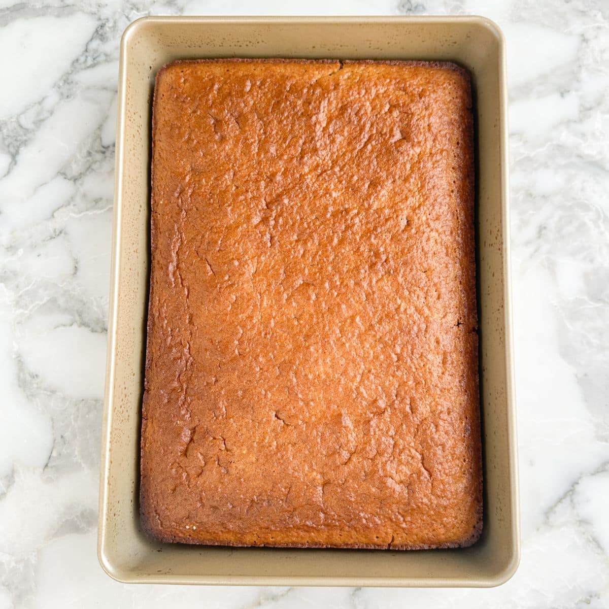 Baked root beer cake in a 9 x 13 pan.
