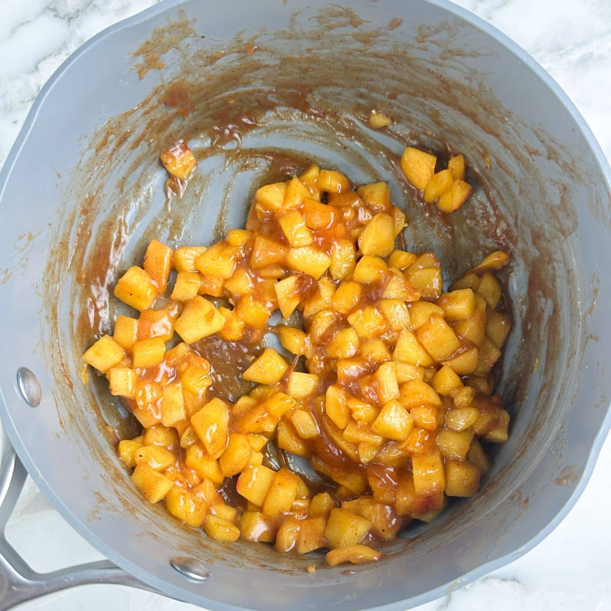 Saucepan with peach pie filling. 