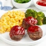 Plate with meatloaf muffins, mac and cheese, and broccoli.