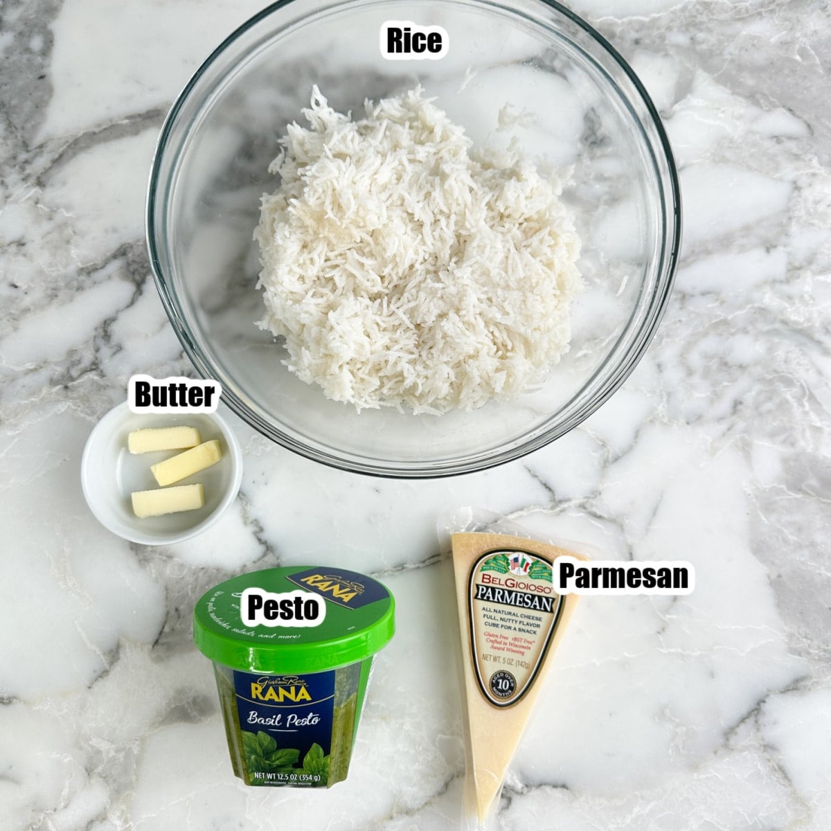 Bowl of rice, butter, pesto, and parmesan. 