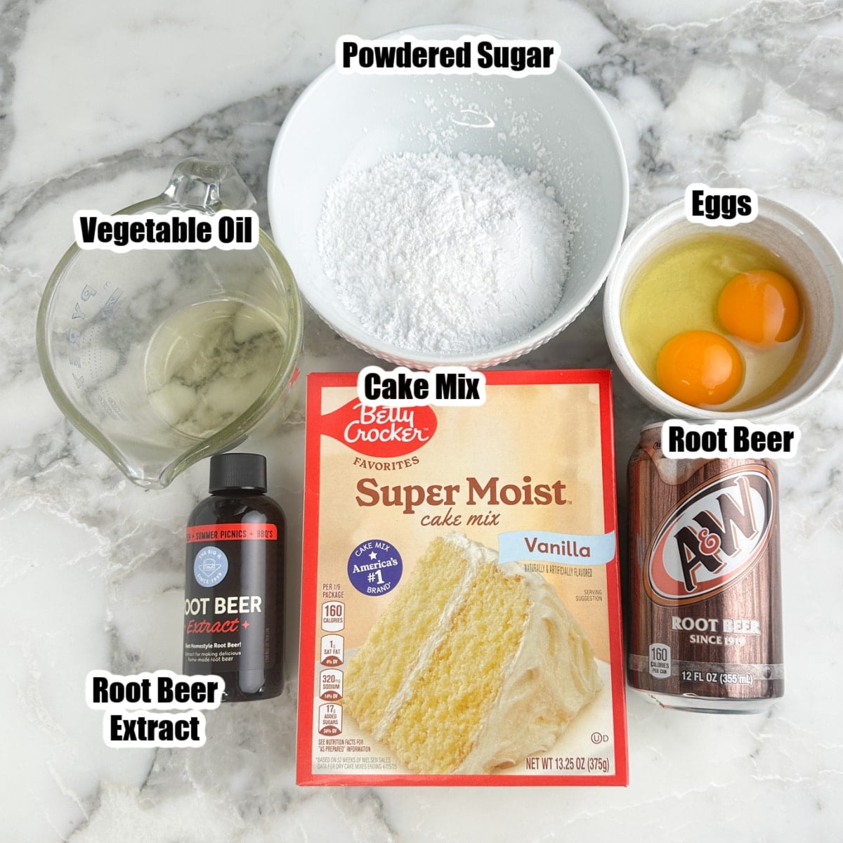 Box of cake mix, vegetable oil, powdered sugar, eggs, can of root beer, and root beer extract.