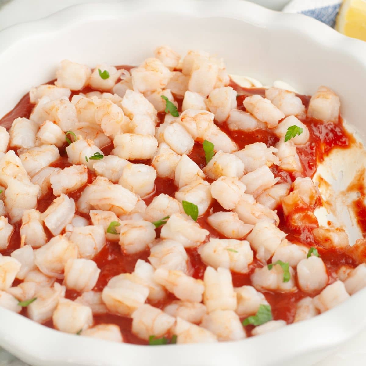 Baking dish with shrimp cream cheese dip.