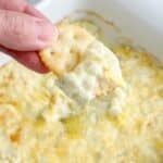 Cracker with three ingredient artichoke dip.