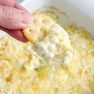 Cracker with three ingredient artichoke dip.