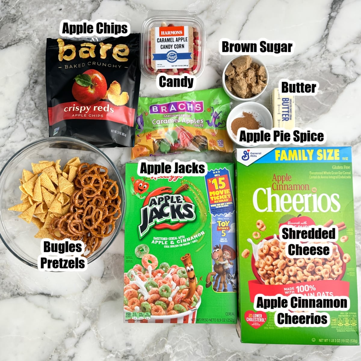 Box of Cheerios, Apple Jacks, Bugles, Pretzles, brown sugar, apple chips, butter, and apple pie spice.