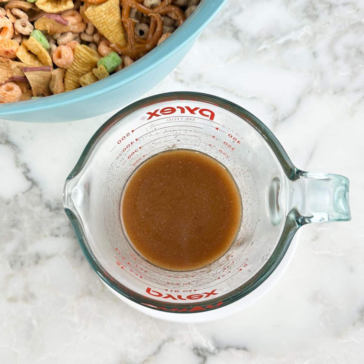 Bowl of melted butter with apple pie spice.