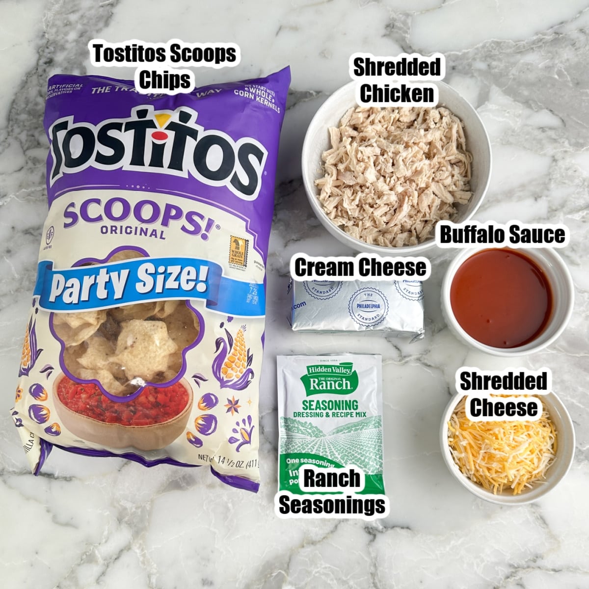 Bag of tortilla chips, shredded chicken, ranch seasonings, cream cheese, buffalo sauce, and shredded cheese.