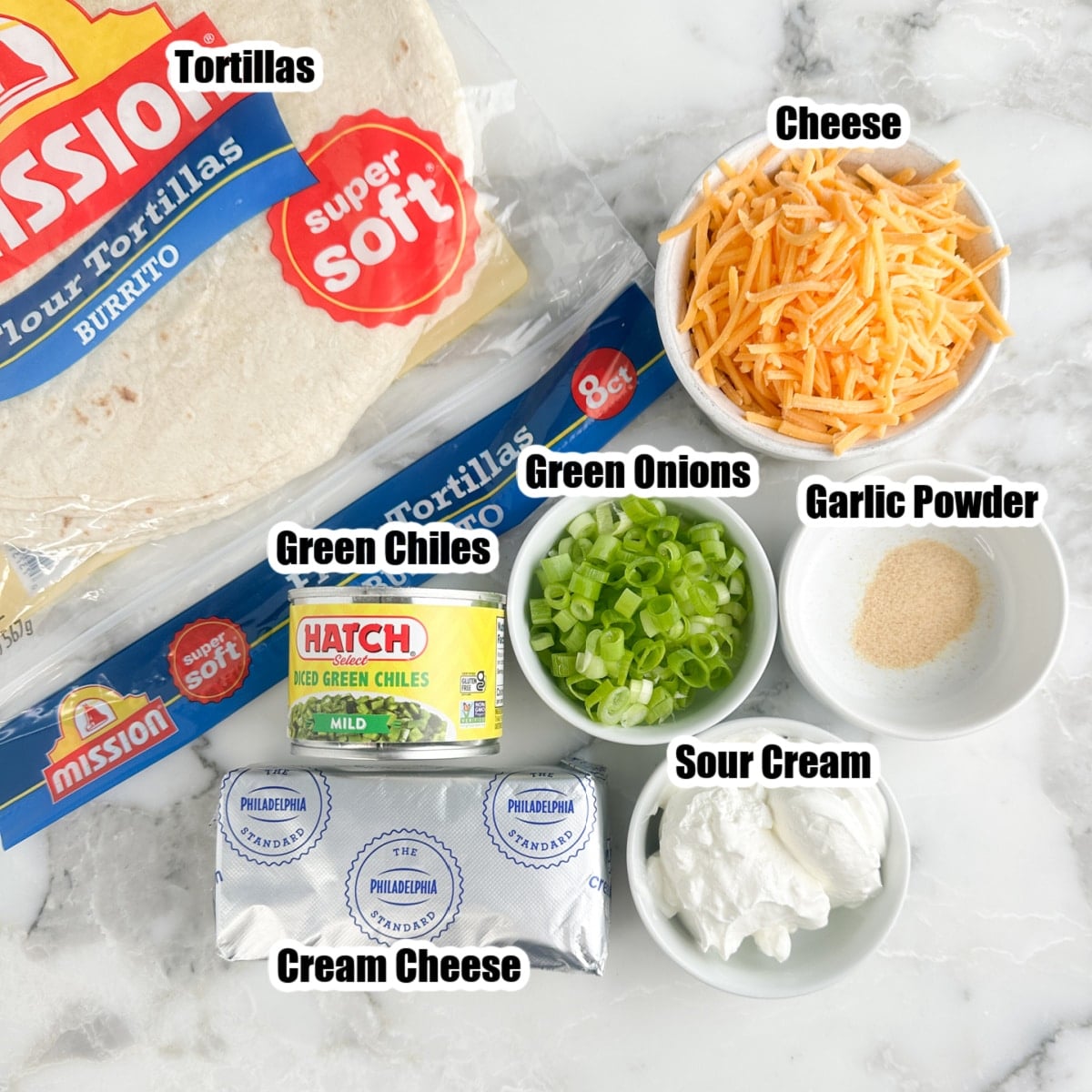 Tortillas, shredded cheese, green onions, garlic powder, sour cream, cream cheese, can of diced green chiles.