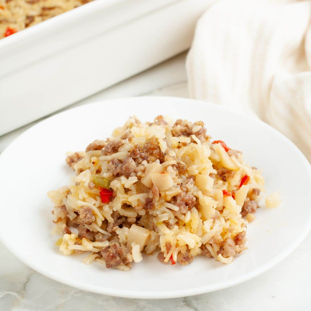 Plate with sausage and rice casserole.