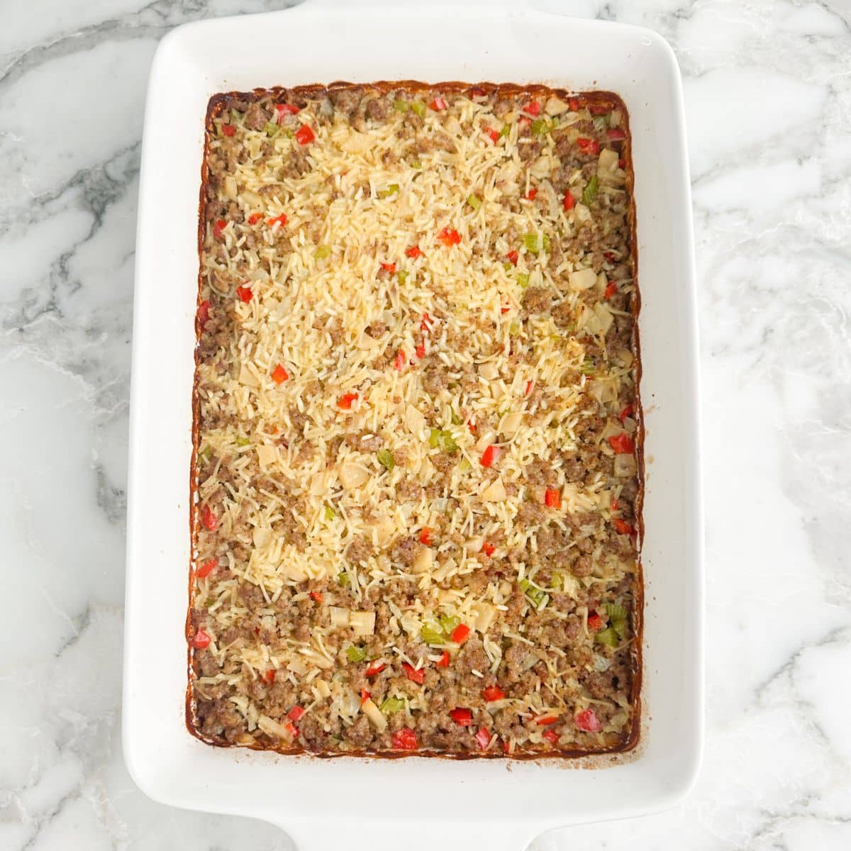 Casserole dish with sausage and rice casserole.