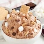 Bowl of s'mores fluff with a graham cracker.