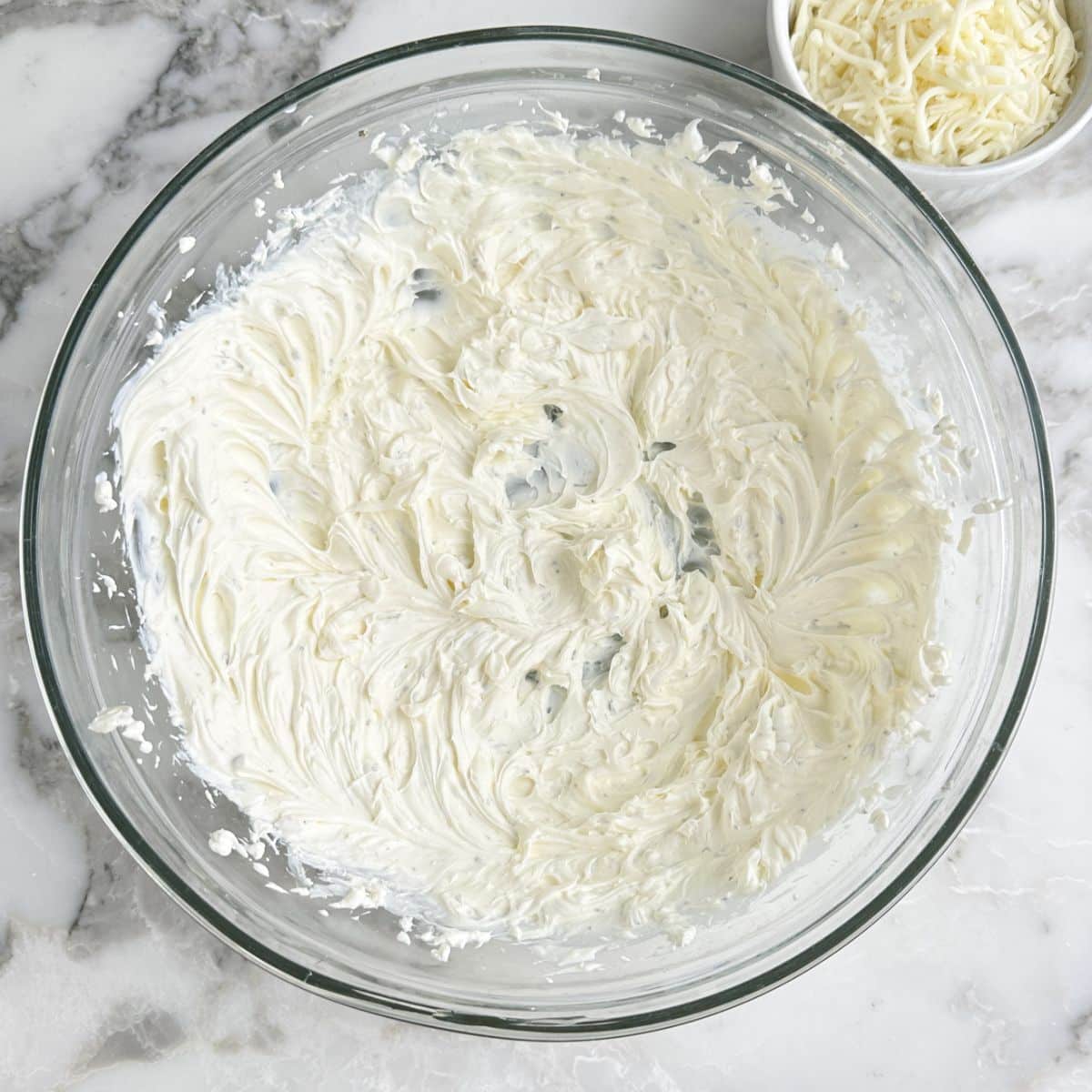 Bowl of whipped cream cheese. 