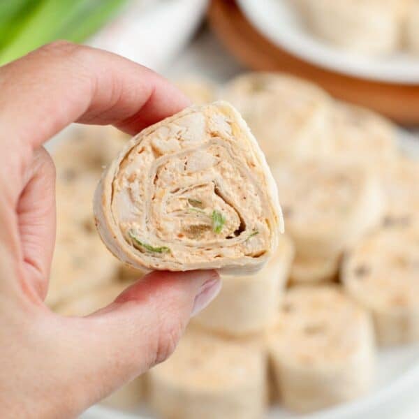 Hand holding a taco pinwheel.