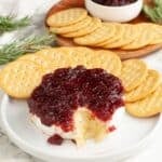 Baked brie topped with cranberry sauce.