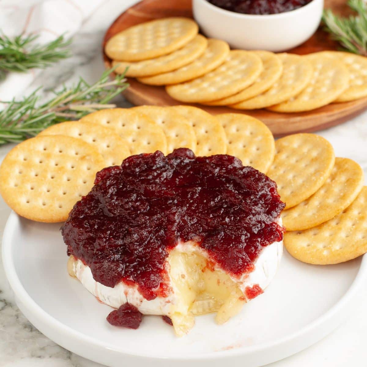 Baked brie topped with cranberry sauce.