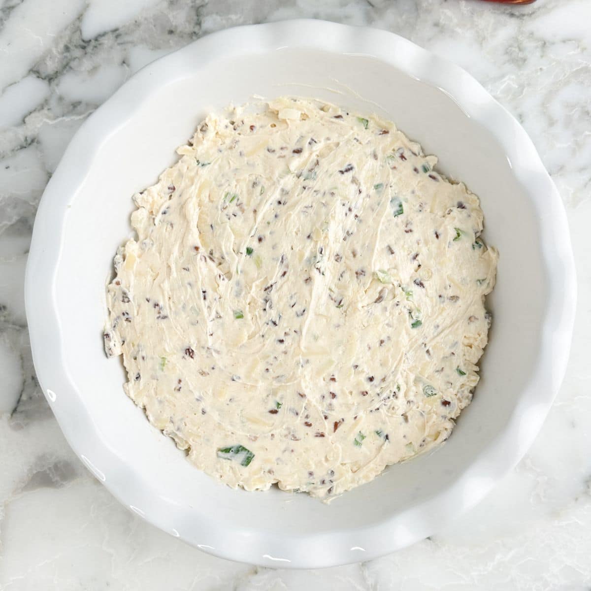 Pie dish with cream cheese mixture.