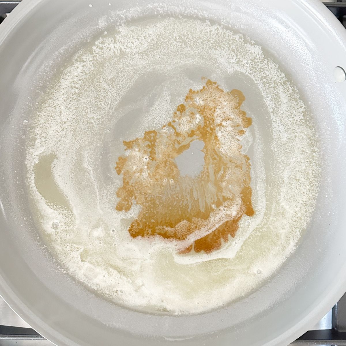 Skillet of melted butter and vanilla. 