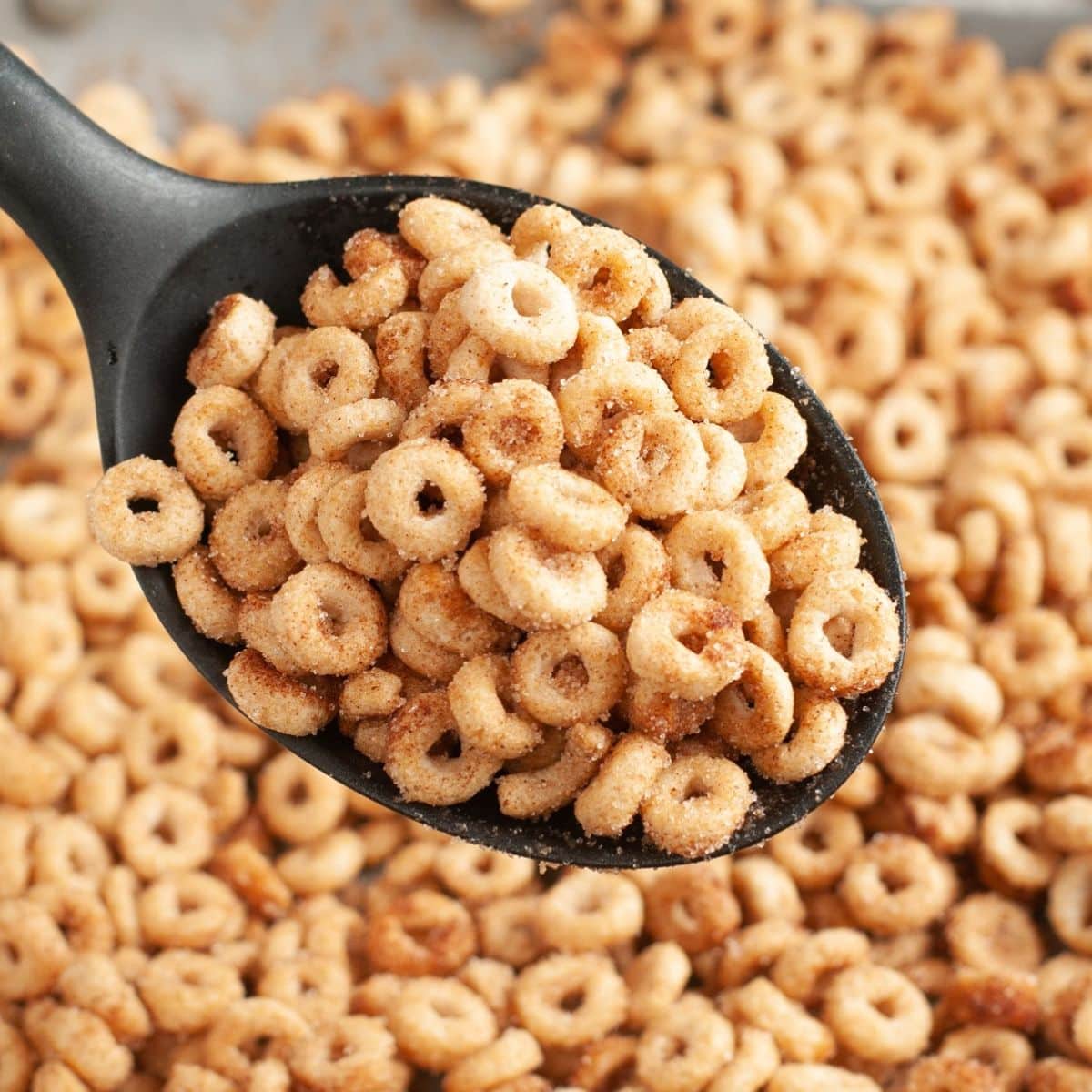Spoon with hot buttered Cheerios. 