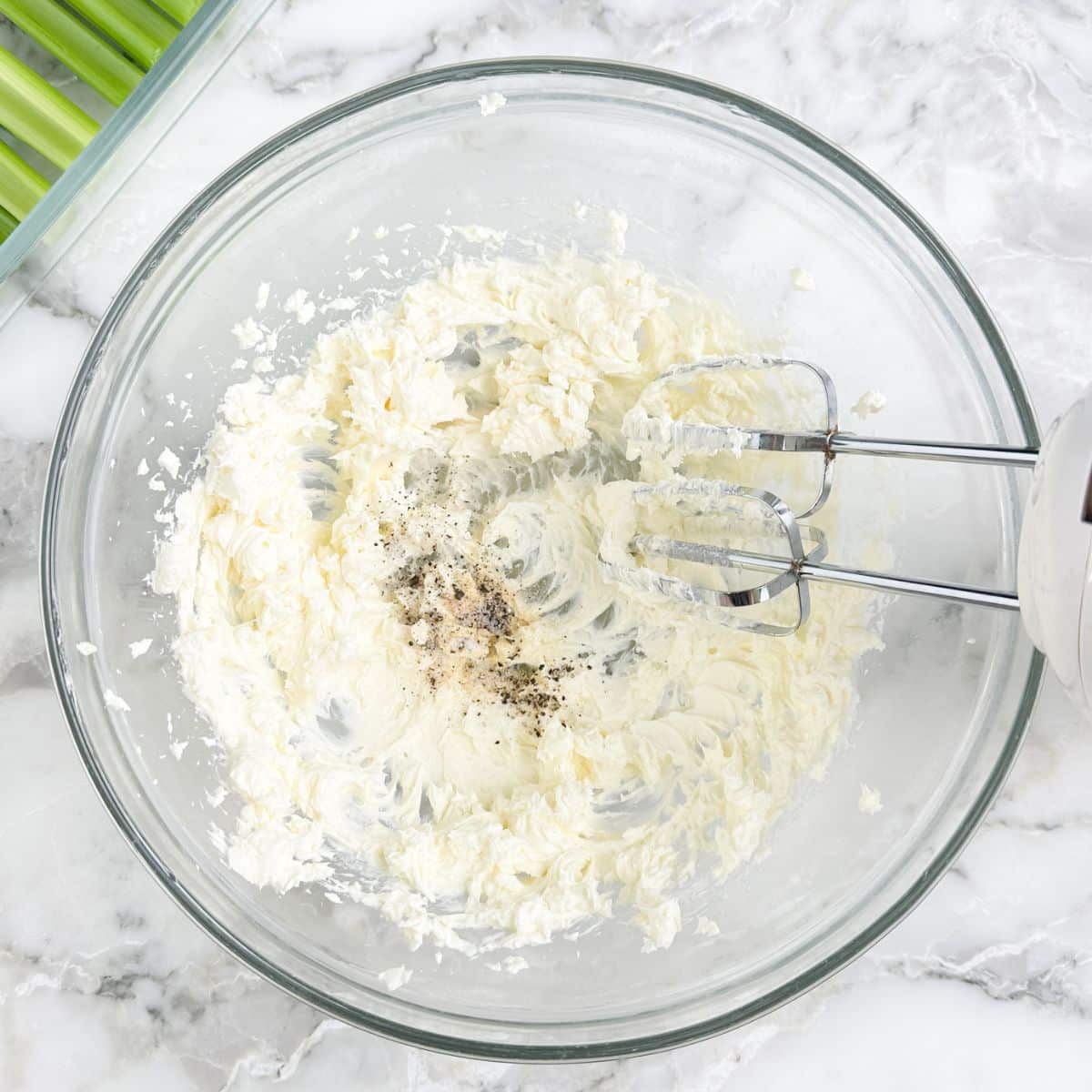 Bowl with whipped cream cheese and seasonings. 