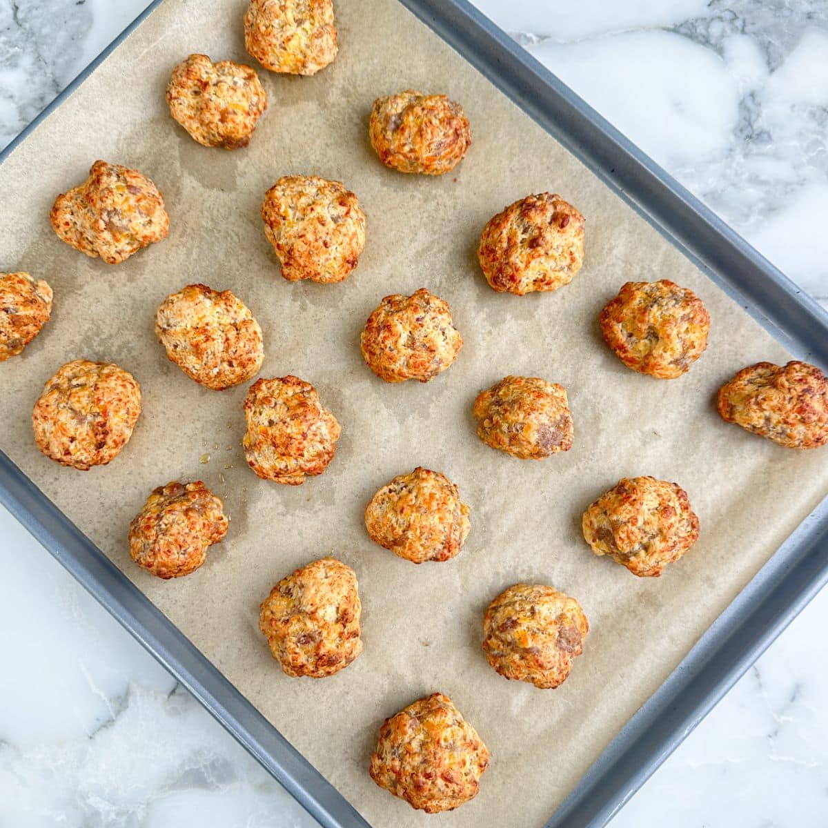 Baking dish with baked pancake mix sausage balls.