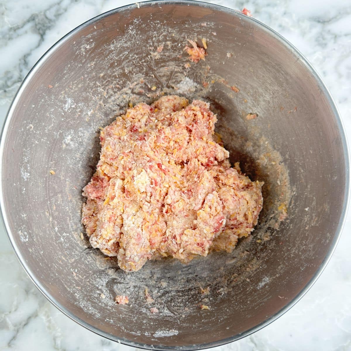 Mixing bowl with sausage ball mixture.
