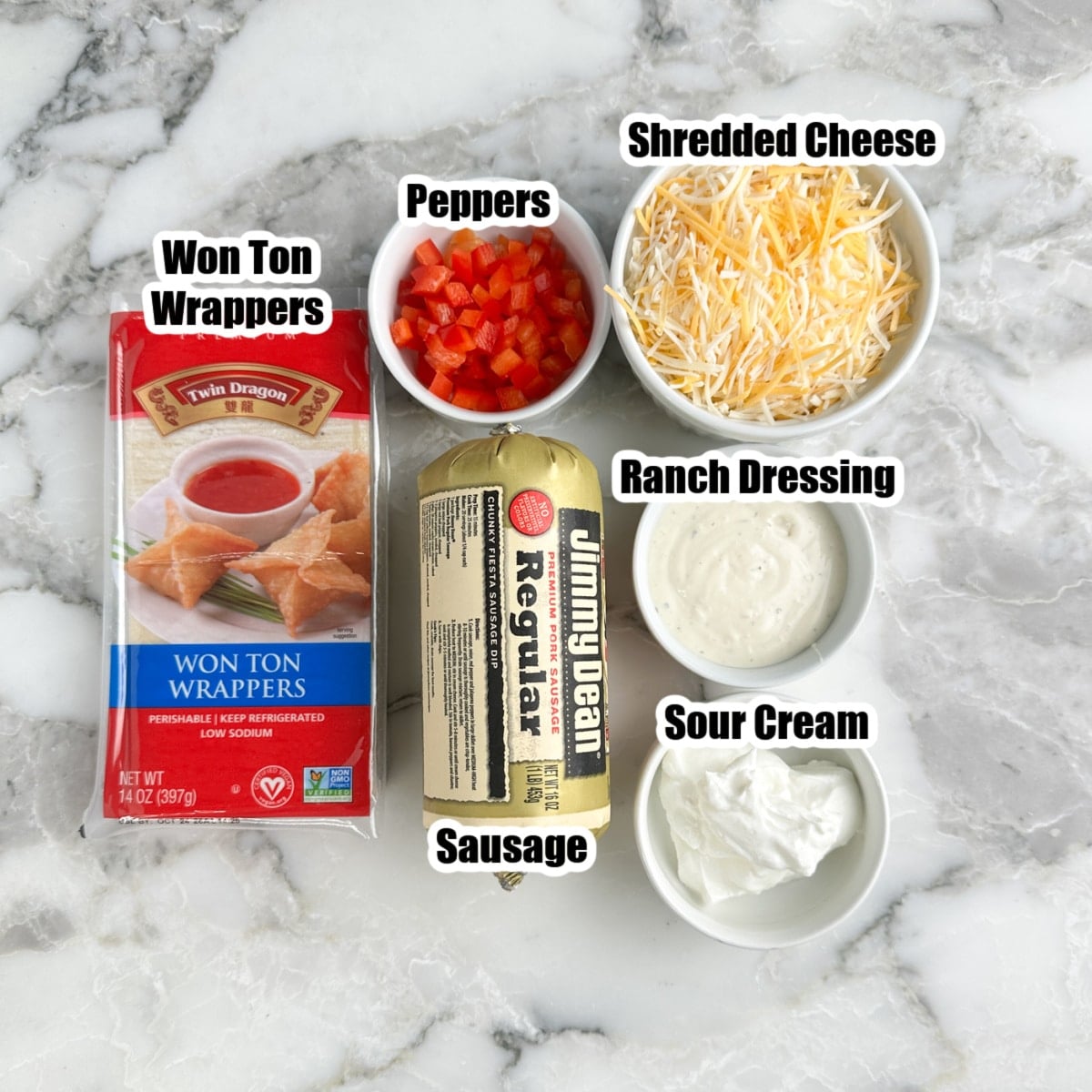 Won ton wrappers, sausage, red peppers, shredded cheese, sour cream, and ranch dressing.